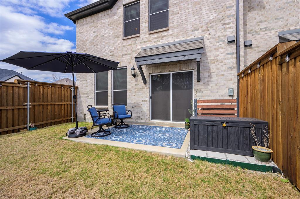 1311 Union Road Celina, TX 75009 - Photo 32 of 38 a backyard of a house with table and chairs