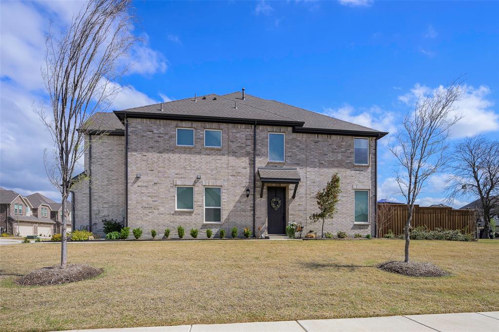 1311 Union Road Celina, TX 75009 - Photo 33 of 38 a front view of a house with a yard