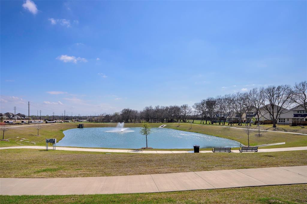 1311 Union Road Celina, TX 75009 - Photo 38 of 38 a view of a lake with houses in the back