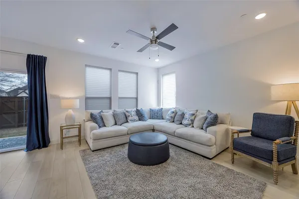 a living room with furniture and white walls