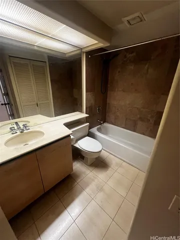 a bathroom with a double vanity sink toilet and shower