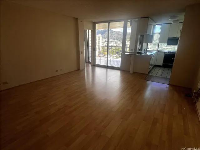 a view of a living room and hardwood floor