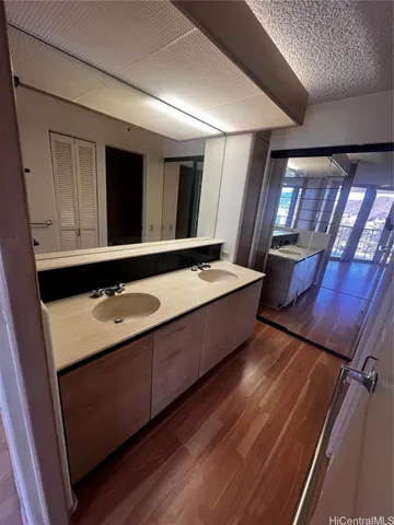 a bathroom with a sink and mirror