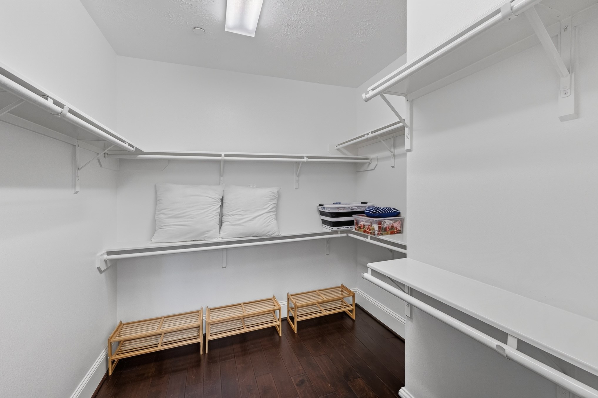 335 Voss Road Houston, TX 77024 - Photo 27 of 50 Upstairs Primary bedroom custom walk-in closet.