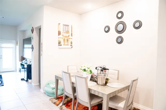 a dining room with furniture and a table