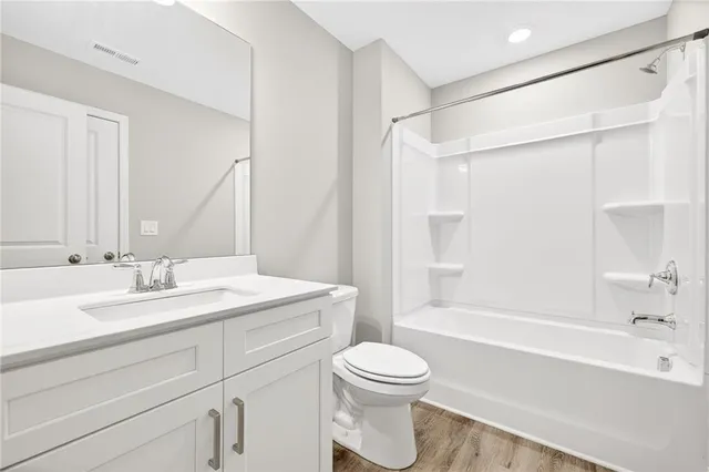 a bathroom with a sink a toilet and a bathtub