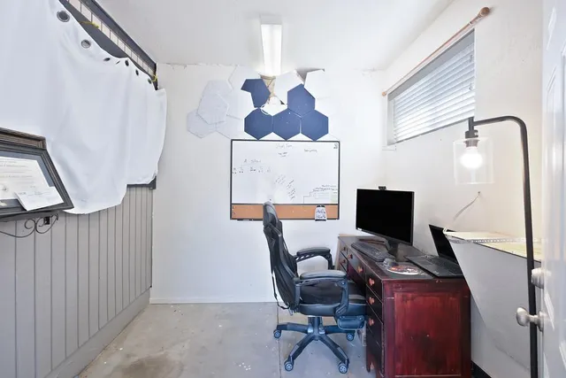 a workspace with furniture and wooden floor