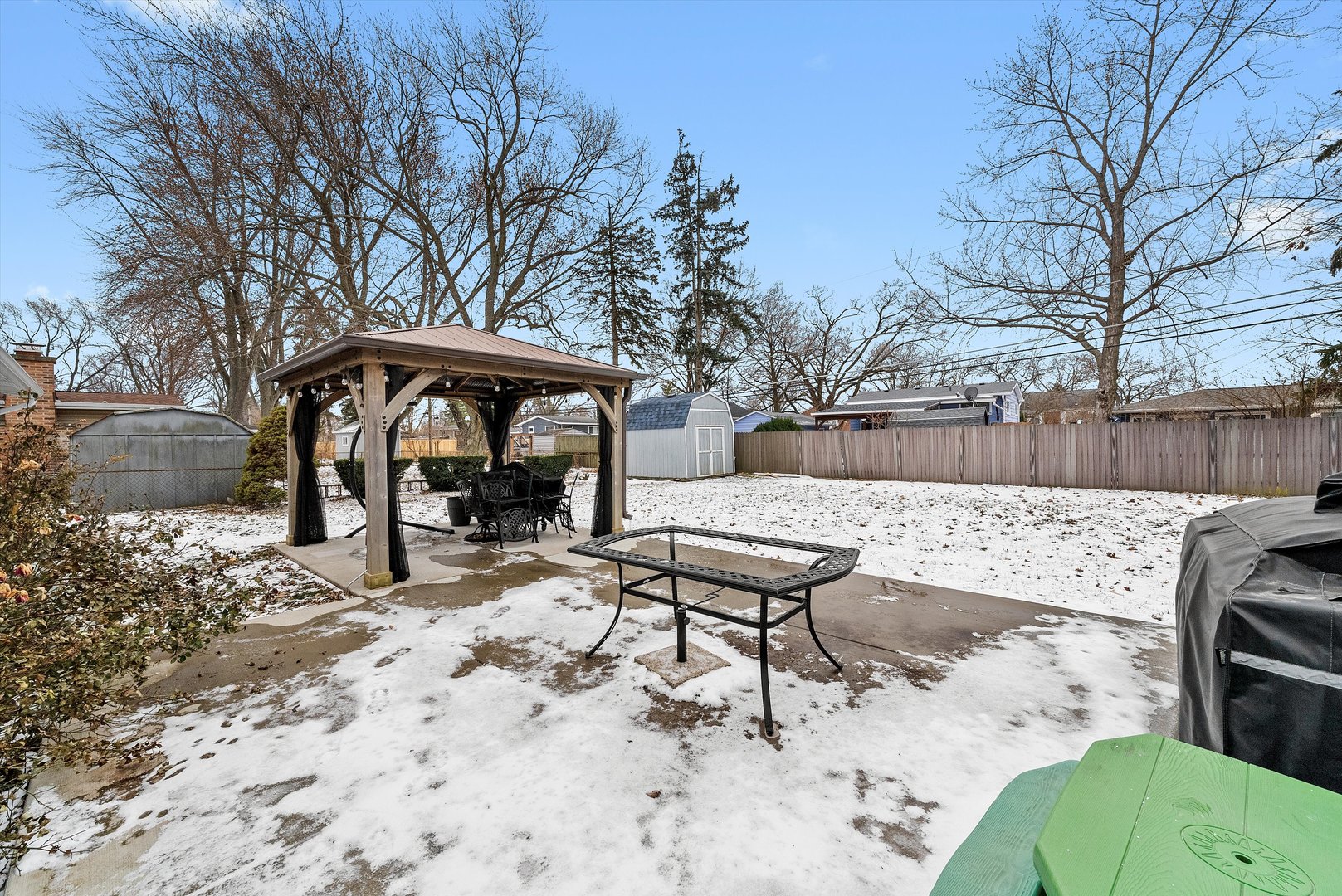 11 Greenfield Road Montgomery, IL 60538 - Photo 19 of 22 a view of a backyard with a table and chairs