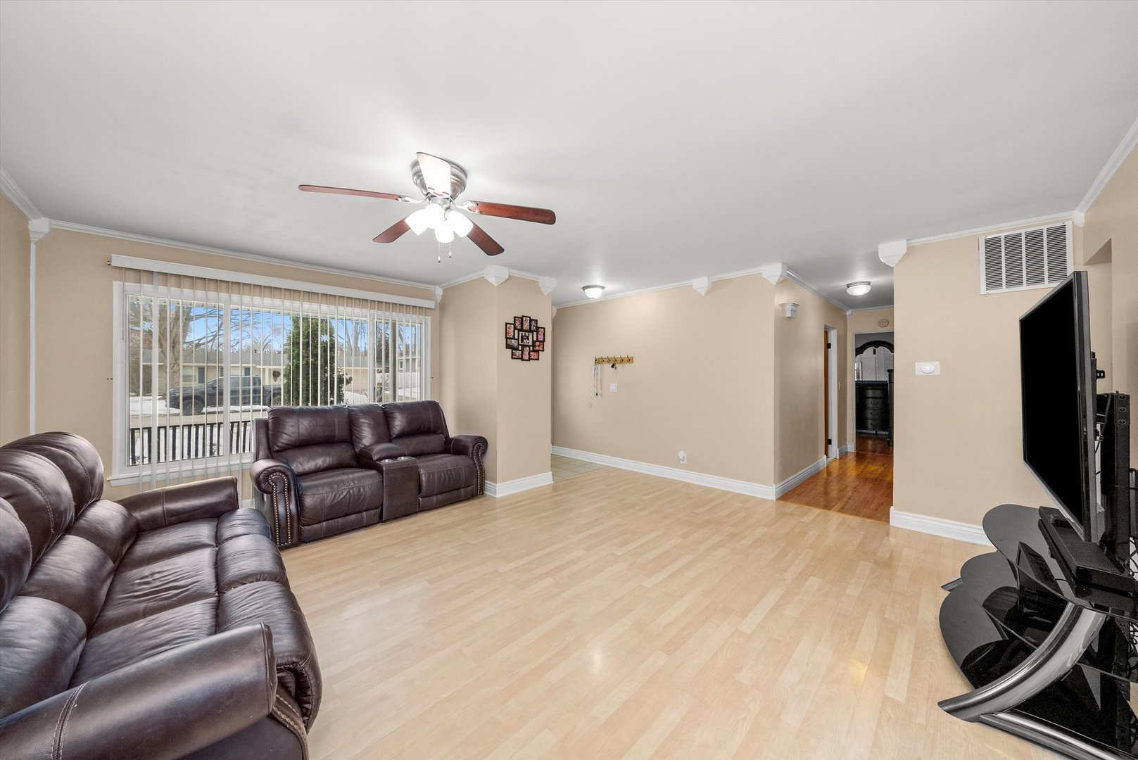 11 Greenfield Road Montgomery, IL 60538 - Photo 5 of 22 a living room with furniture a flat screen tv and a large window