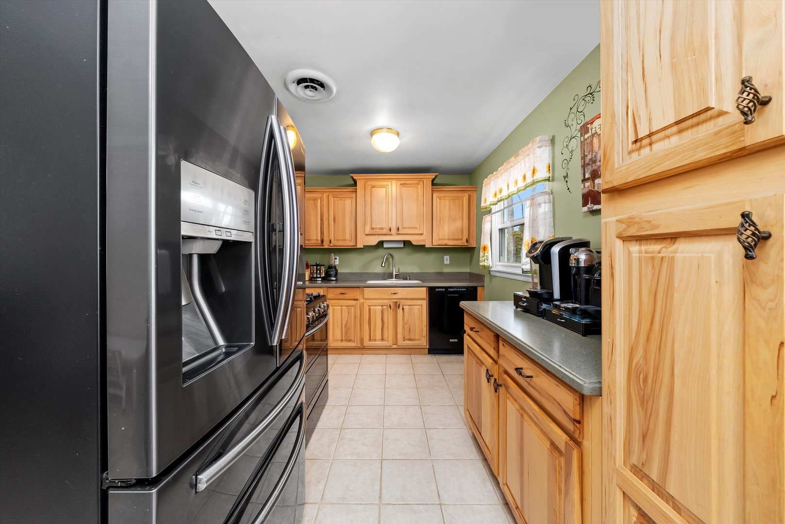 11 Greenfield Road Montgomery, IL 60538 - Photo 7 of 22 a kitchen with a refrigerator a sink and wooden floor