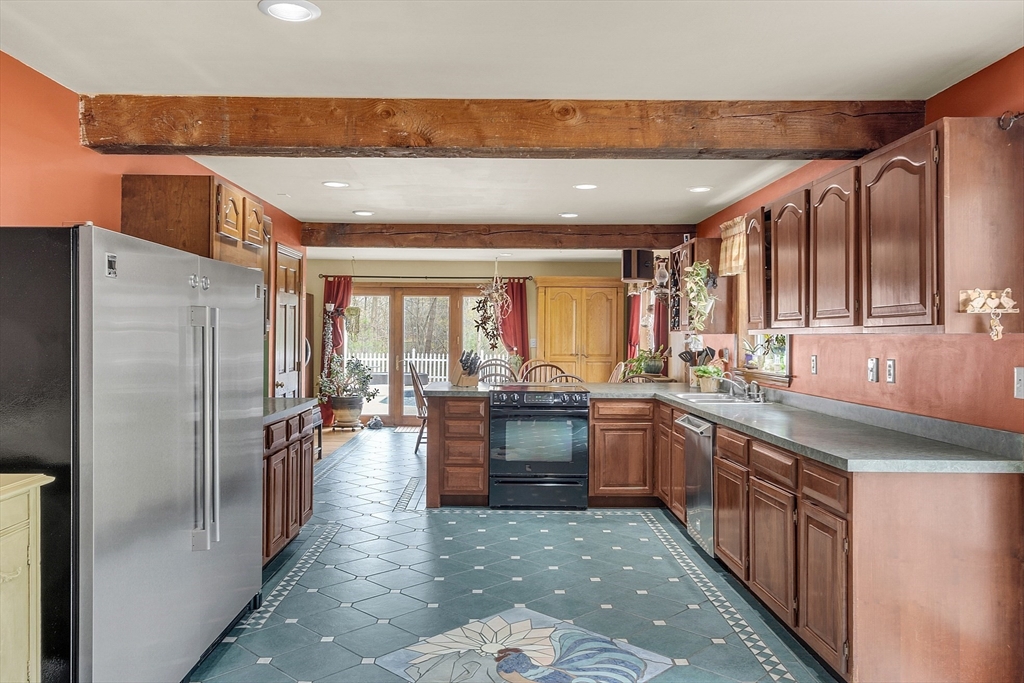 23 Harrington Road Westminster, MA 01473 - Photo 20 of 42 a large kitchen with lots of counter space and stainless steel appliances