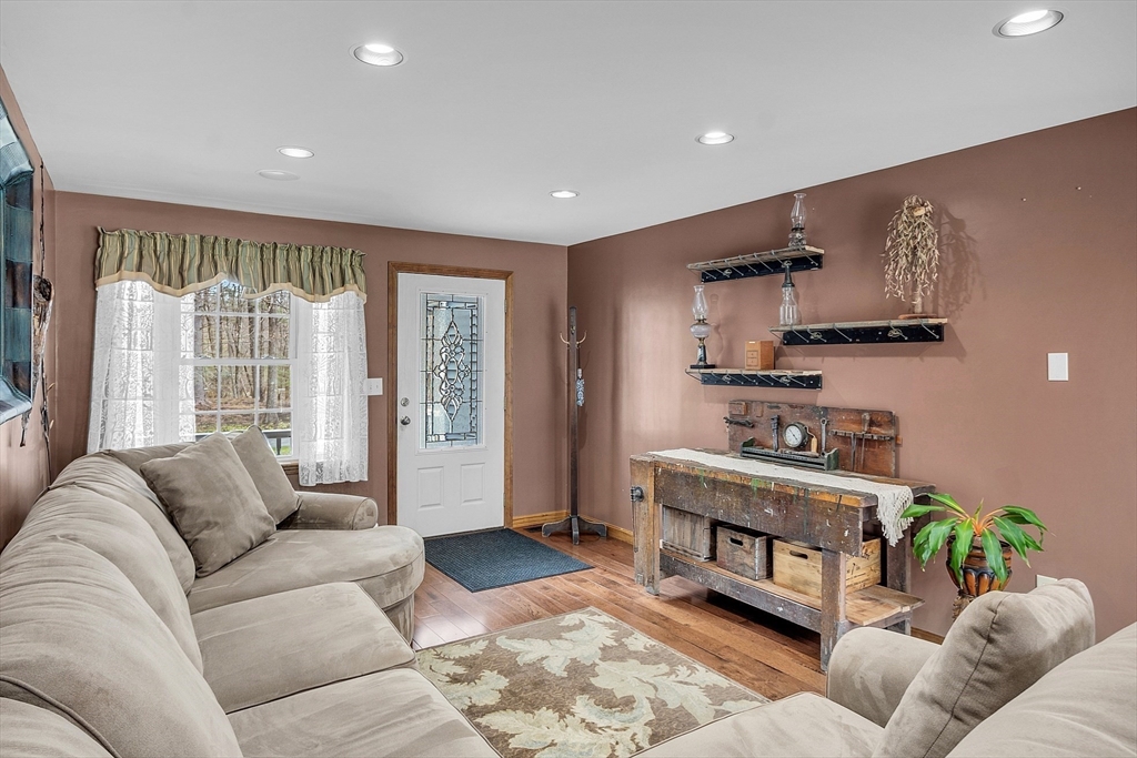 23 Harrington Road Westminster, MA 01473 - Photo 22 of 42 a living room with furniture and large windows