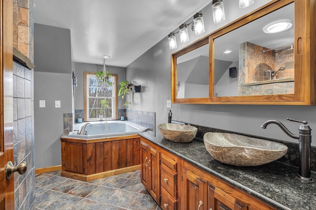 23 Harrington Road Westminster, MA 01473 - Photo 32 of 42 a bathroom with a granite countertop sink and a mirror