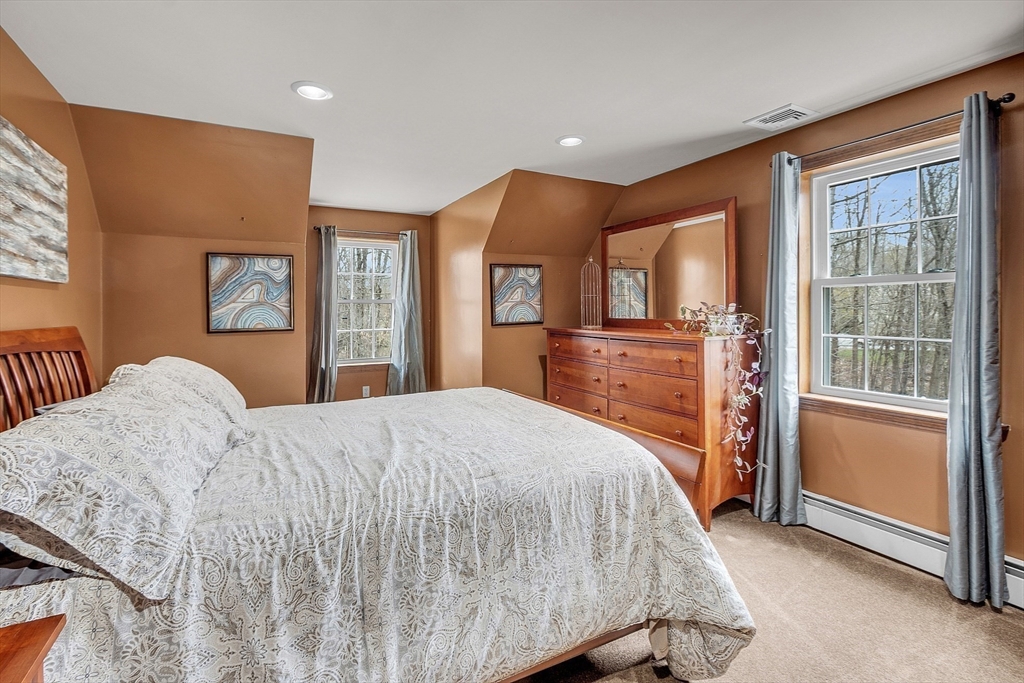 23 Harrington Road Westminster, MA 01473 - Photo 34 of 42 a bedroom with a large bed and a dresser