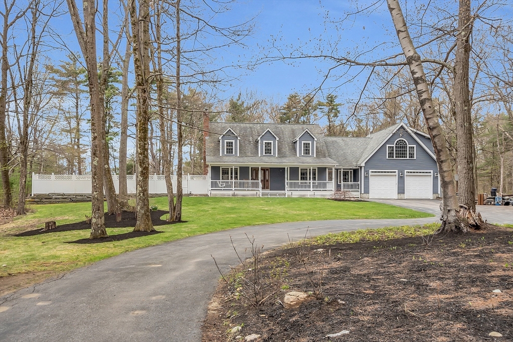 23 Harrington Road Westminster, MA 01473 - Photo 5 of 42 a front view of a house with a yard and trees