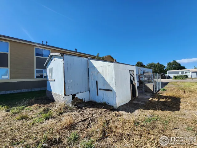 a view of a livingroom with gym equipment