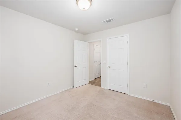 a bathroom with a bathtub shower sink vanity and toilet