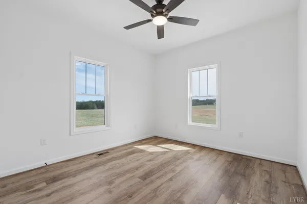 a view of balcony with wooden floor