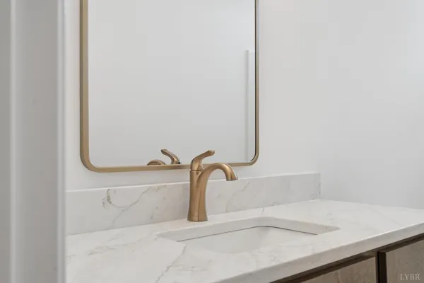 a view of a house with a yard chairs and table in the patio