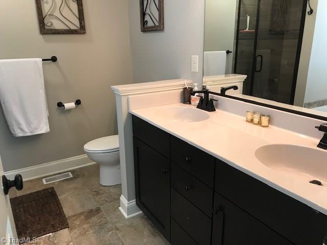 2021 Mountain View Road King, NC 27021 - Photo 12 of 29 Master bath with double sink, separate shower and garden tub.