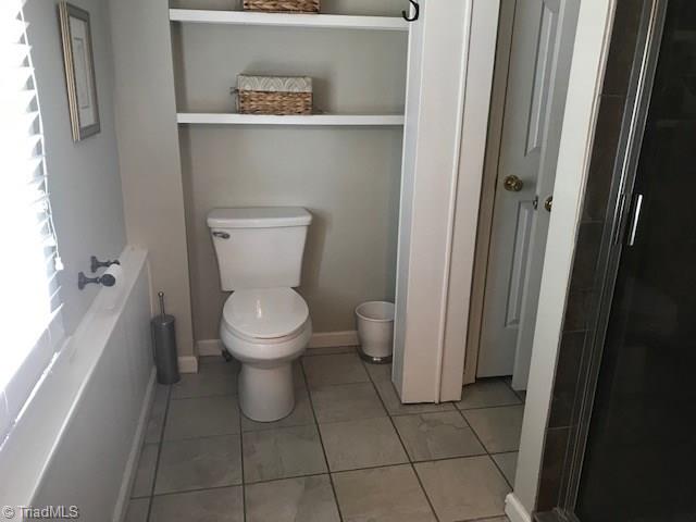2021 Mountain View Road King, NC 27021 - Photo 17 of 29 Upstairs bath has built in shelves and closet.