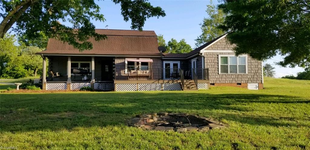 Across the back of house, from left to right...... back porch, back deck and den