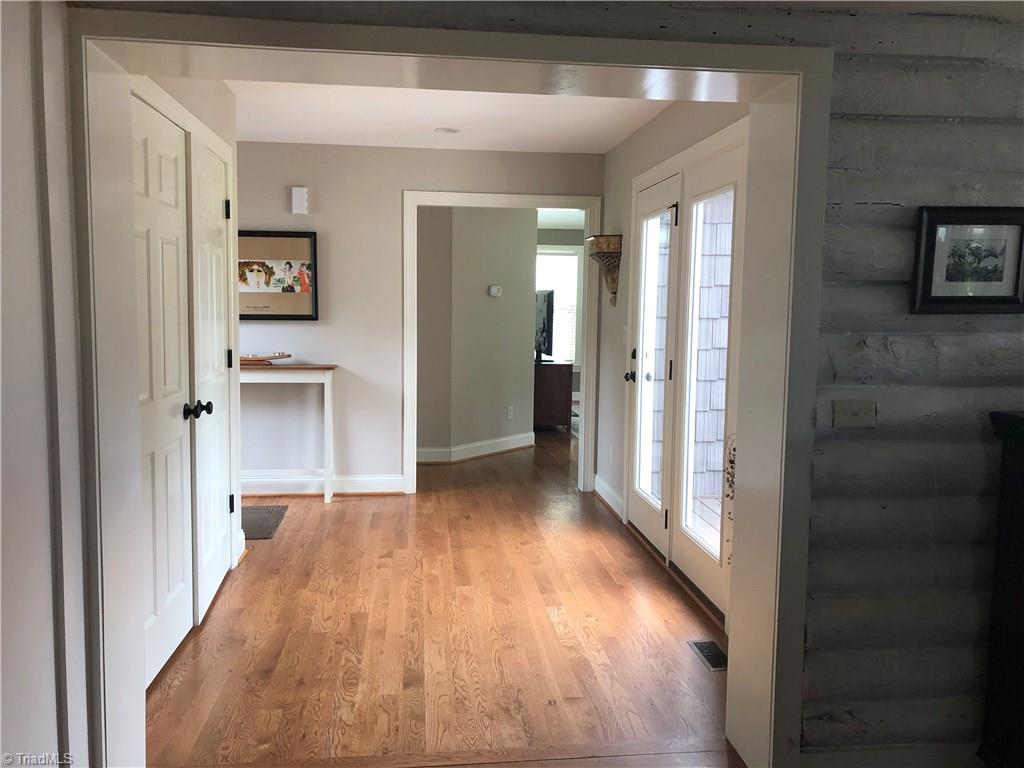 2021 Mountain View Road King, NC 27021 - Photo 27 of 29 Walk-thru into den with laundry on the left, door to front patio is also on the left and double doors onto back porch is on the right.