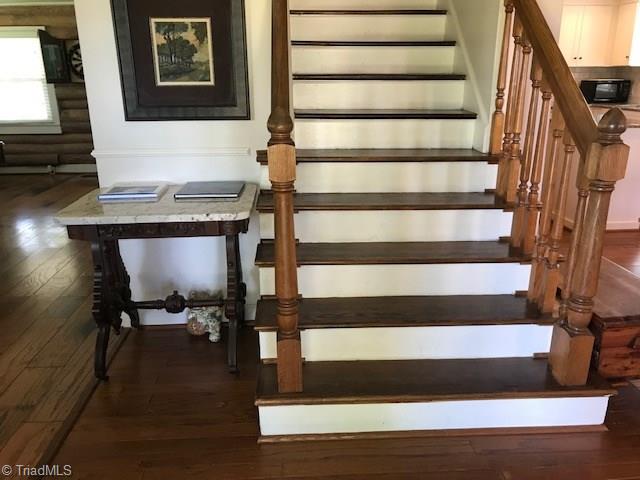 Stairs from back entrance to the upstairs.