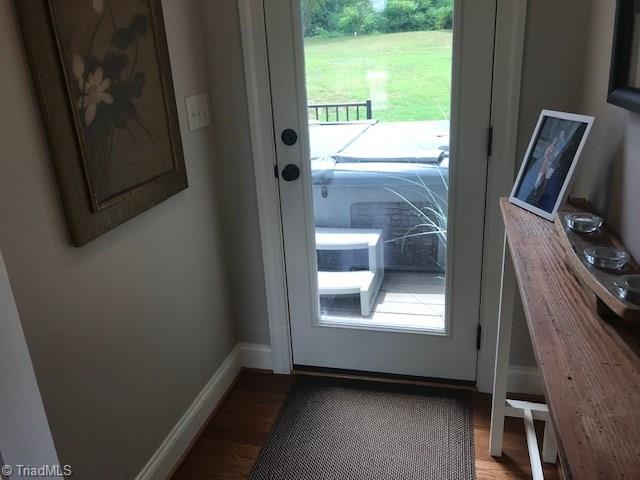 2021 Mountain View Road King, NC 27021 - Photo 10 of 29 Single glass door leads to front patio with hot tub (it stays)!