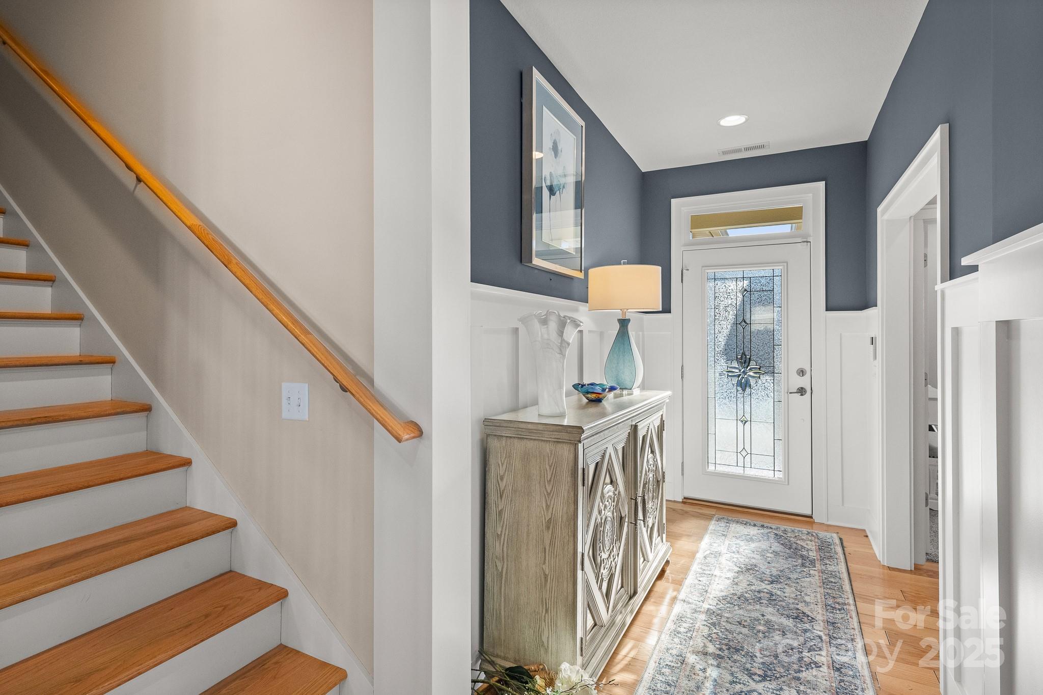 235 Windstone Drive Fletcher, NC 28732 - Photo 23 of 40 a view of a hallway with wooden floor and staircase