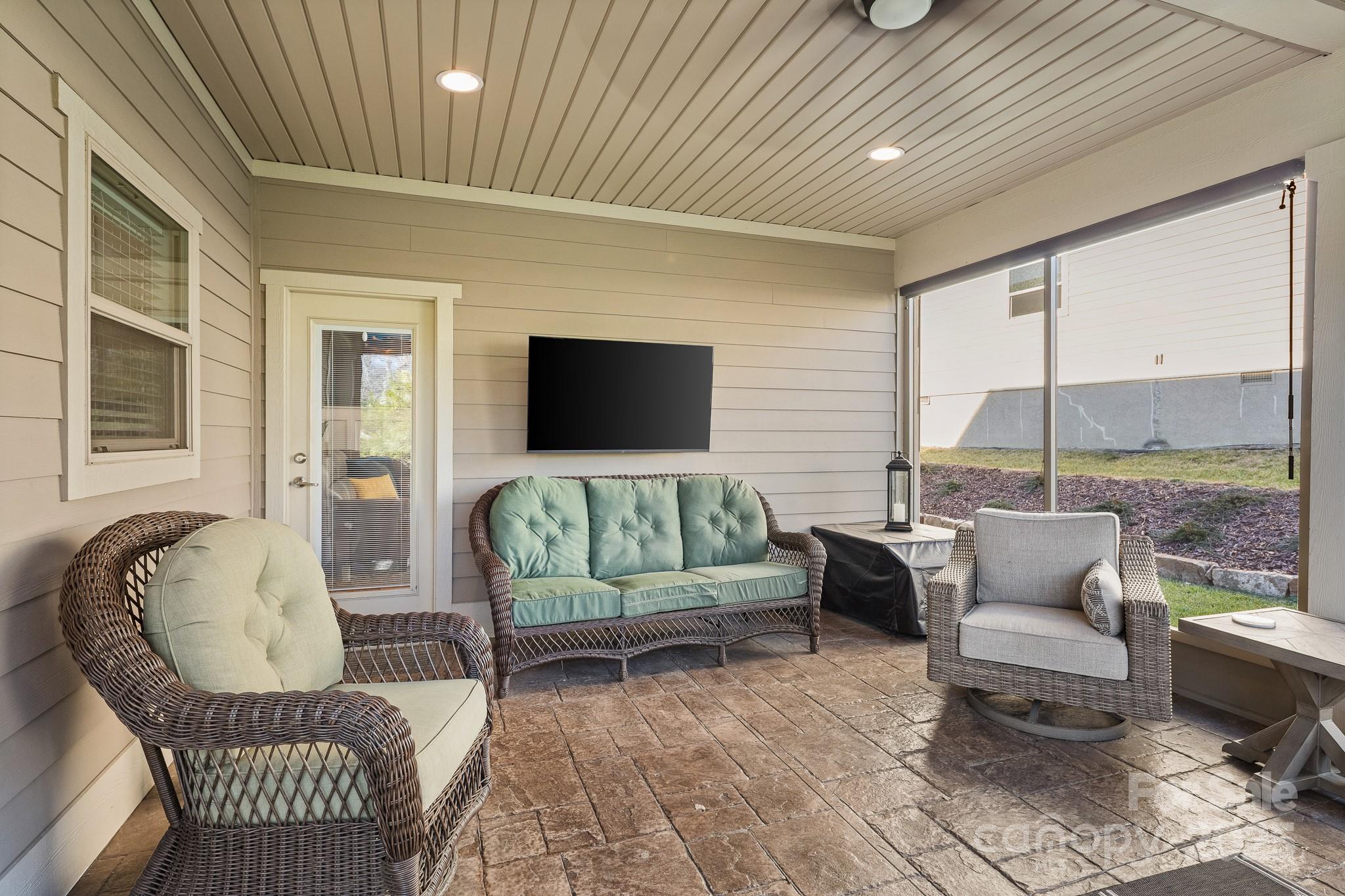 235 Windstone Drive Fletcher, NC 28732 - Photo 34 of 40 a living room with furniture and a flat screen tv