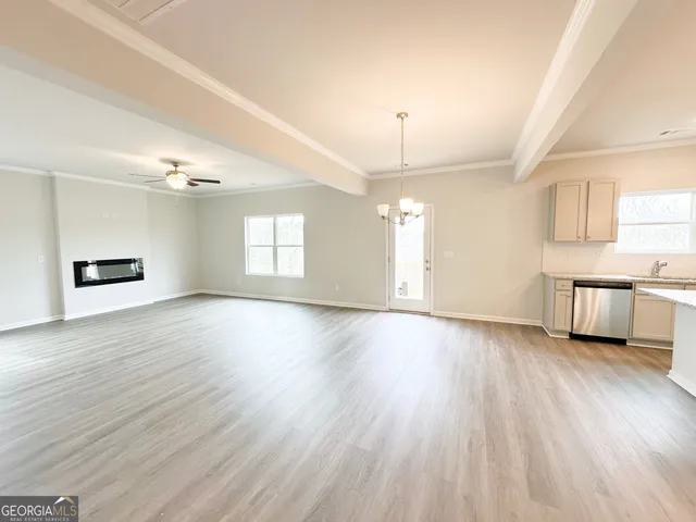 a view of a kitchen with a sink and a window