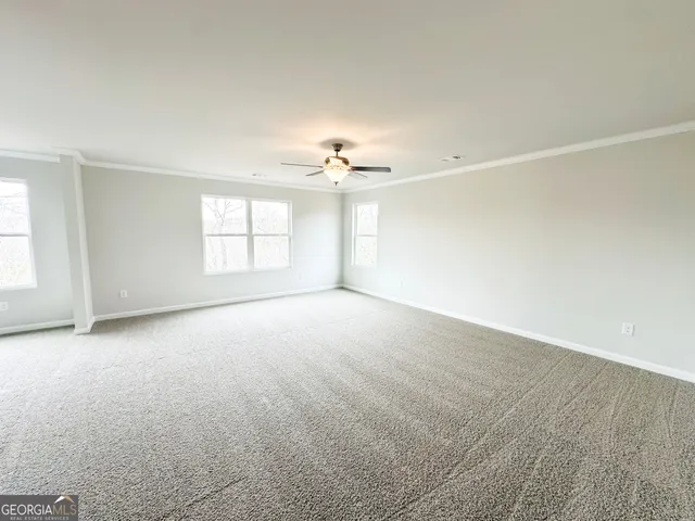 an empty room with an empty space and a window