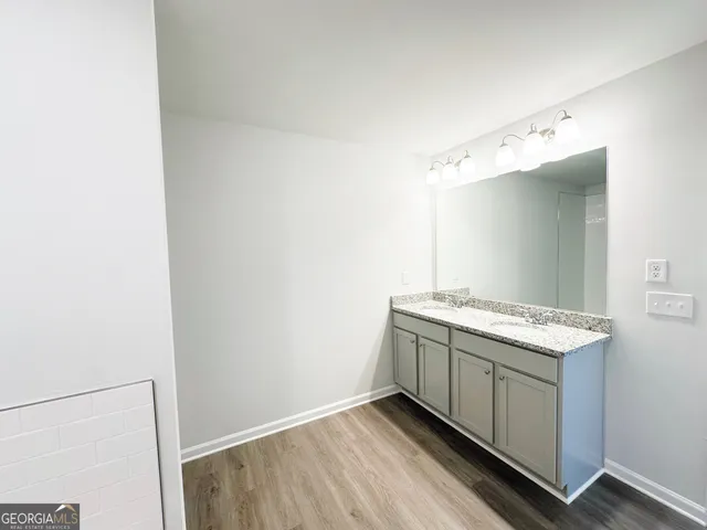 a utility room with cabinets washer and dryer