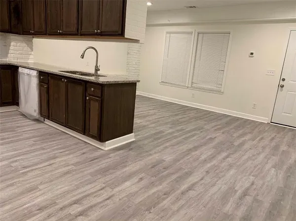 a kitchen with a sink and cabinets