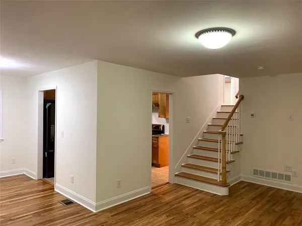 a view of entryway with wooden floor
