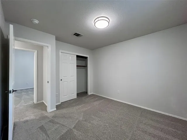 an empty room with a bathroom