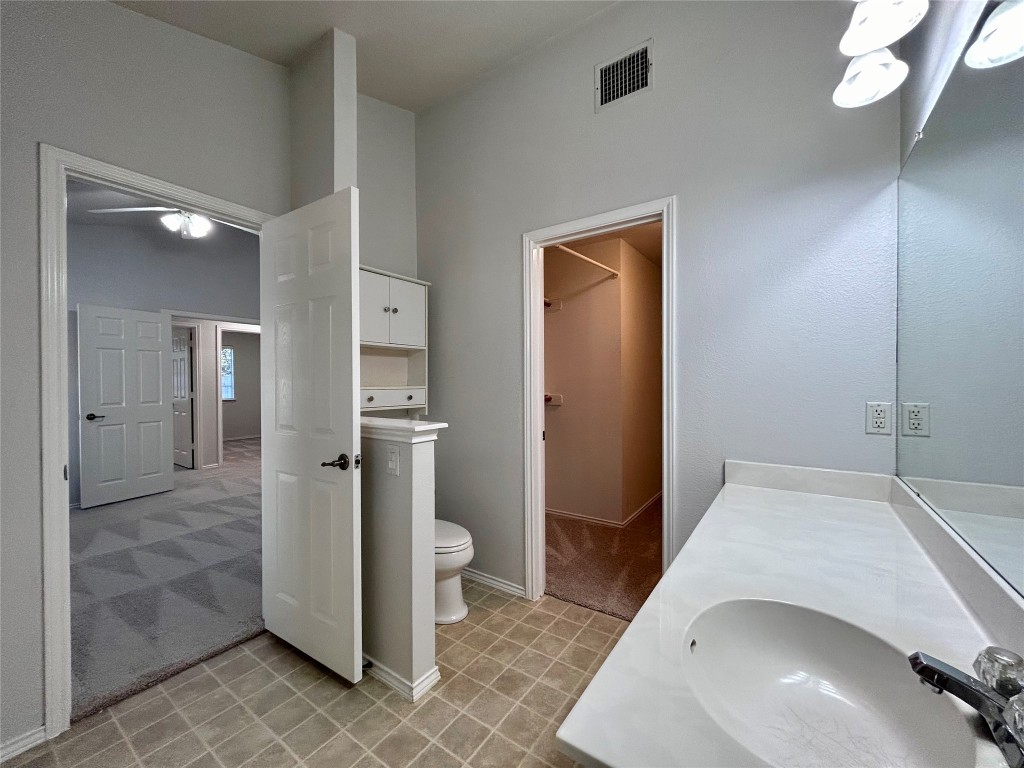 716 Leann Lane Cedar Park, TX 78613 - Photo 20 of 29 a view of a hallway with bathroom and a sink