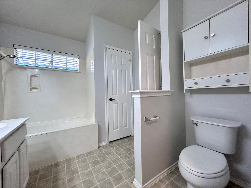 716 Leann Lane Cedar Park, TX 78613 - Photo 22 of 29 a bathroom with a toilet a sink and bathtub