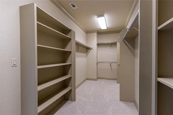 a view of an empty walk in closet
