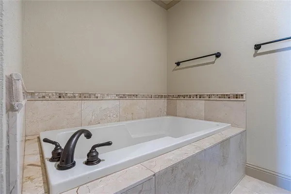 a bath tub sitting next to a sink