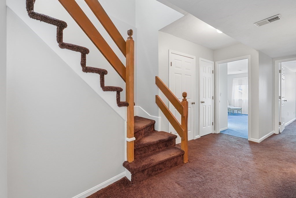 306 Tappan Street, Unit B Brookline, MA 02445 - Photo 12 of 35 a view of entryway with wooden floor and stairs
