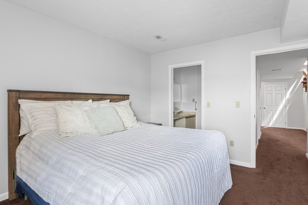 306 Tappan Street, Unit B Brookline, MA 02445 - Photo 15 of 35 a bedroom with a bed and a night lamp