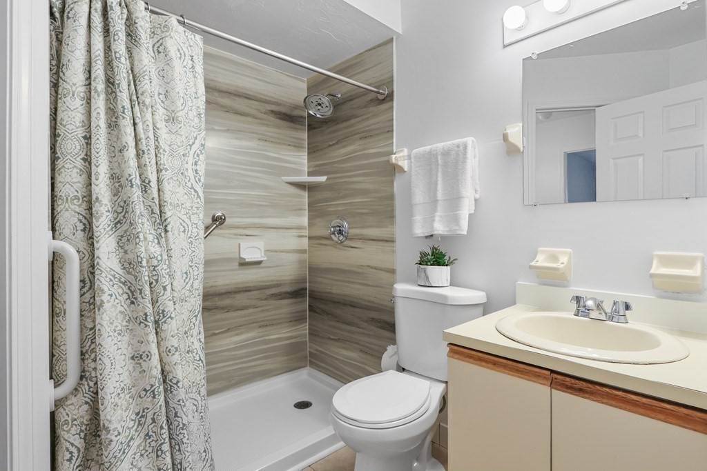 306 Tappan Street, Unit B Brookline, MA 02445 - Photo 18 of 35 a bathroom with a sink toilet and shower