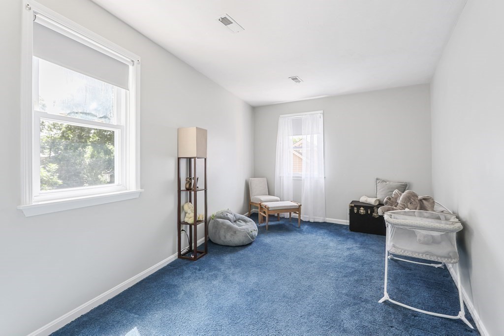 306 Tappan Street, Unit B Brookline, MA 02445 - Photo 24 of 35 a room with furniture and a window