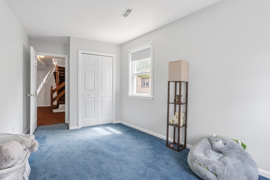 306 Tappan Street, Unit B Brookline, MA 02445 - Photo 25 of 35 a view of livingroom with furniture and closet