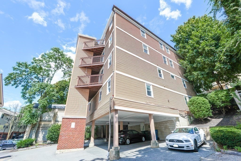 306 Tappan Street, Unit B Brookline, MA 02445 - Photo 31 of 35 a car parked in front of a building