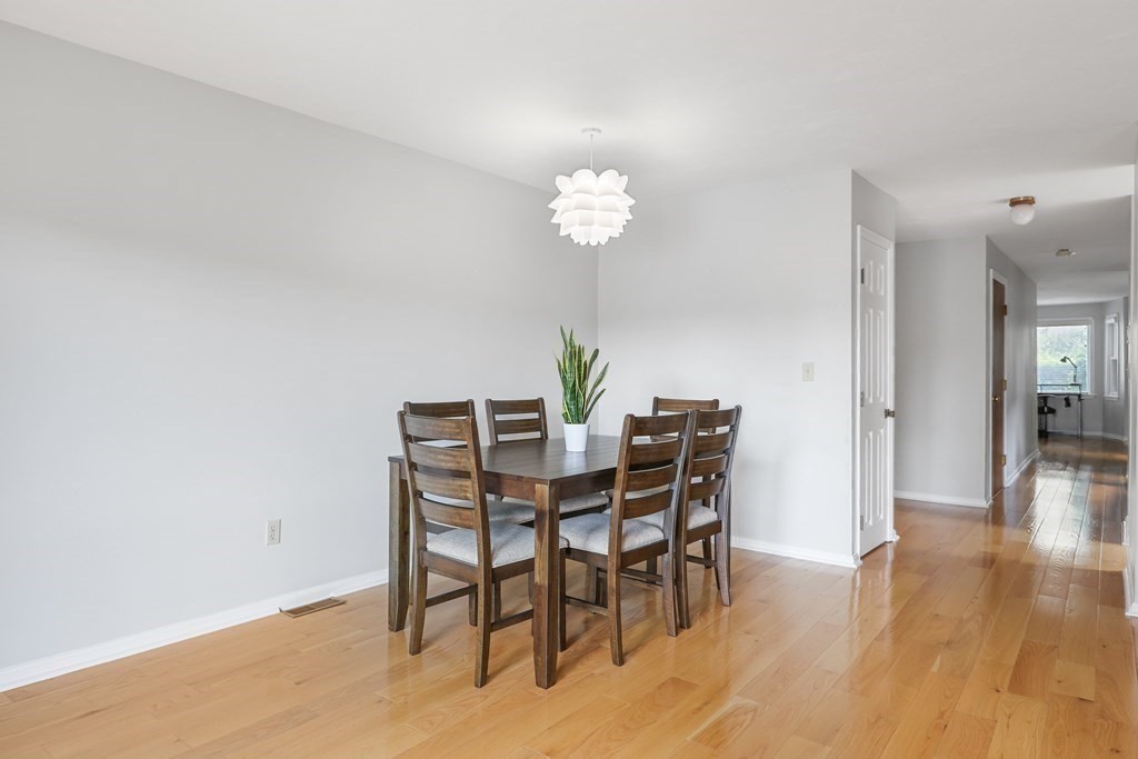 306 Tappan Street, Unit B Brookline, MA 02445 - Photo 5 of 35 a view of a dining room with furniture and wooden floor