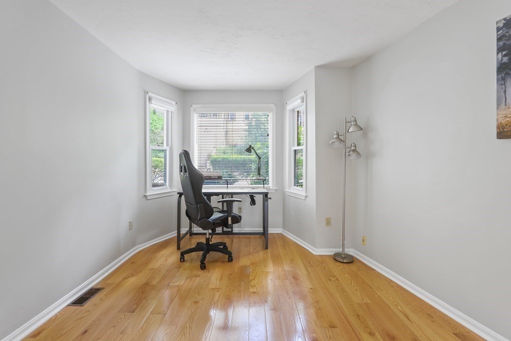 306 Tappan Street, Unit B Brookline, MA 02445 - Photo 6 of 35 a view of a workspace with furniture and a window