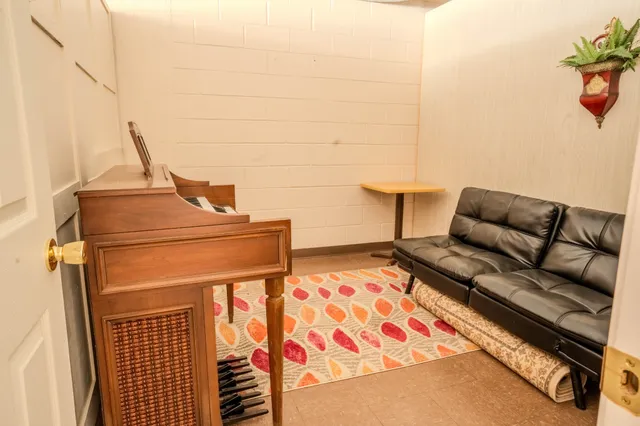 a room with a wooden floor and a table